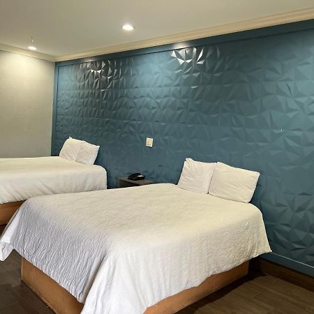 The Symphony Inn & Suites Хюстън Екстериор снимка