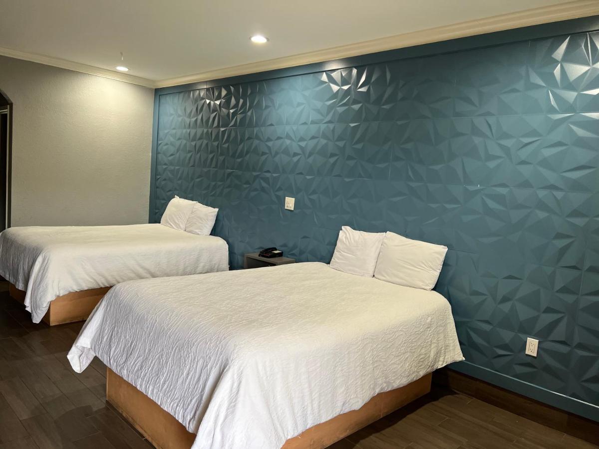 The Symphony Inn & Suites Хюстън Екстериор снимка