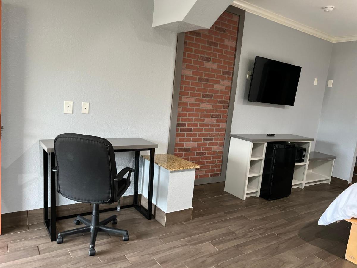 The Symphony Inn & Suites Хюстън Екстериор снимка
